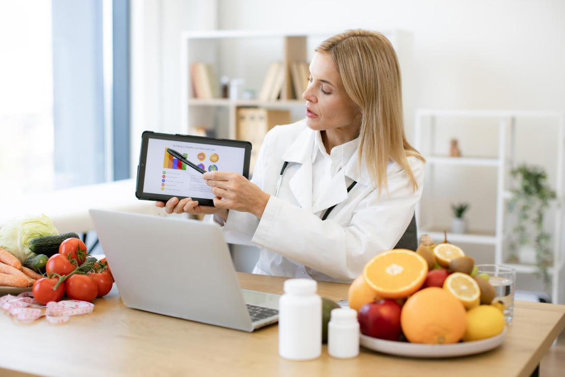 A nutritionist analyzing data on a tablet, representing the accuracy of AI food trackers.